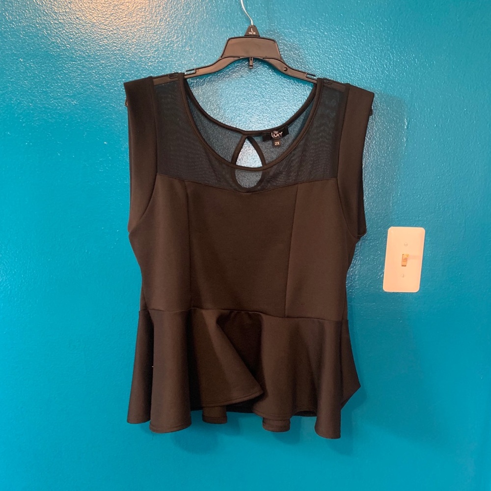 Black peplum top with sheer top